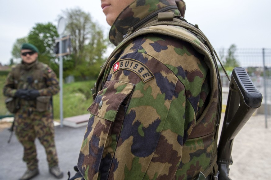 Swiss soldiers patrol at the Swiss-French border of the Greenway as an additional measure, during the Swiss state of emergency due to the coronavirus COVID-19, in Thonex near Geneva, Switzerland, Tues ...