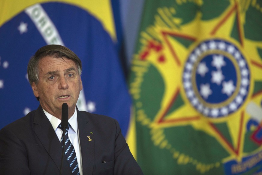 epa10037567 The president of Brazil Jair Bolsonaro, speaks during the presentation of new national identity documents, including the new Brazilian passport in the Palace do Planalto of Brasilia, Brazi ...