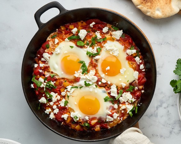Shakshouka, eggs poached in sauce of tomatoes, olive oil, peppers, onion and garlic, Mediterranean cuisine. Keto meal, FODMAP recipe, low carb