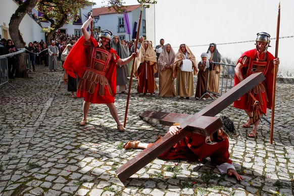epa12039520 Actors perform during the Stations of the Cross, representing the last moments of Jesus&#039; life before the crucifixion, during the Easter celebrations on Good Friday in Ourem, Portugal, ...