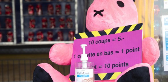 A bottle of hydro-alcoholic as a precaution against the spread of the coronavirus COVID-19 is displayed past a animal stuffed, during the Luna Park on the Bank of the Geneva lake, in Geneva, Switzerla ...