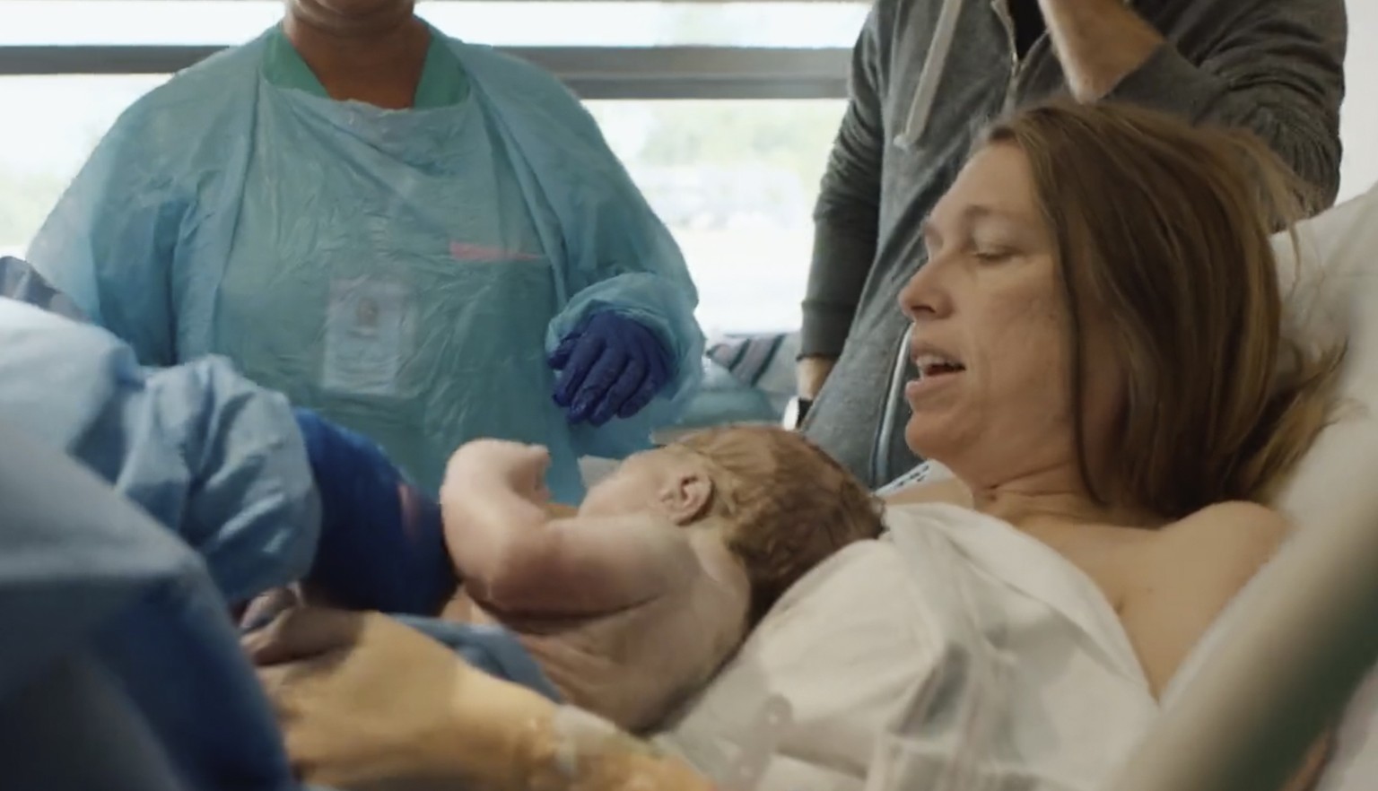 In this image taken from a campaign video posted by Katie Darling, Darling holds her newborn son moments after giving birth. Darling said she was seven months pregnant when she decided to join Louisia ...