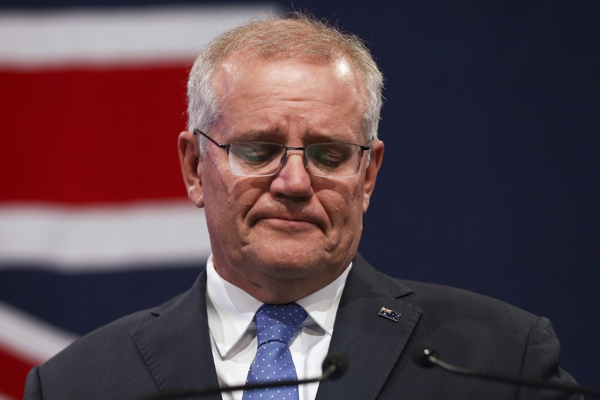 Australian Prime Minister Scott Morrison reacts during his address to a Liberal Party function in Sydney, Australia, Saturday, May 21, 2022. Morrison has conceded defeat and has confirmed that he woul ...