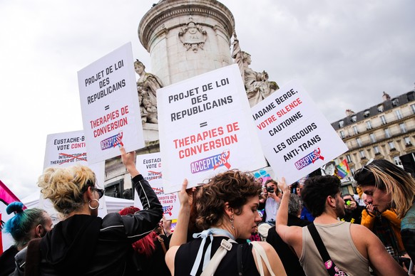 epa11320012 Protesters carry signs with the message &#039;Republican bill = Conversion therapy&#039; during a demonstration in support of transgender people in Paris, France, 05 May 2024. This demonst ...