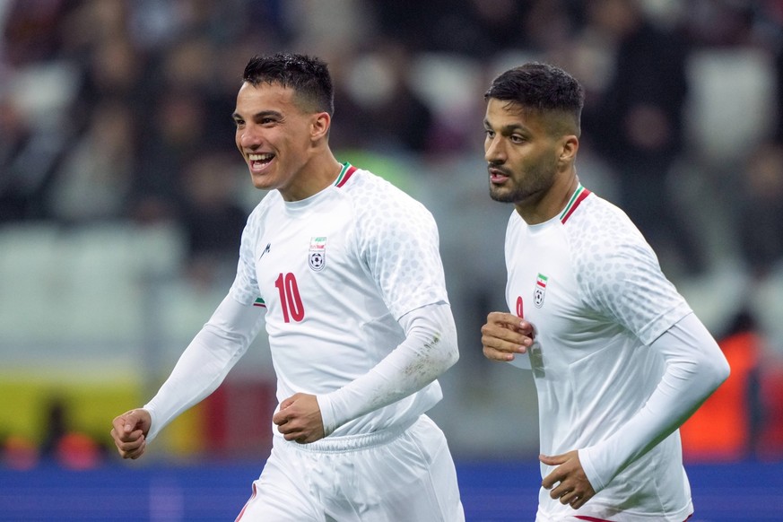 Russia Soccer Friendly Russia - Iran 9023675 10.10.2025 Iran s Amirhossein Hosseinzadeh celebrates with teammate Mohammad Mohebi after scoring his team s first goal during the friendly soccer match be ...