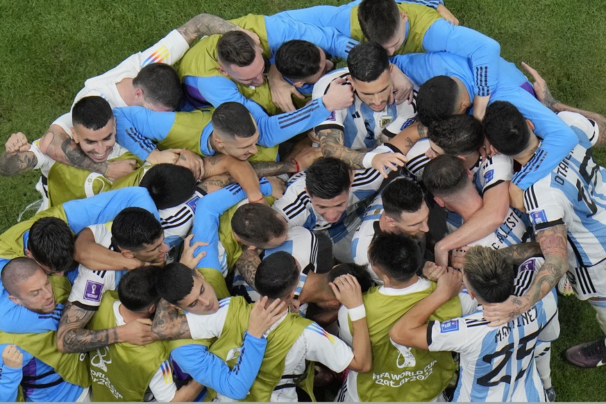 Argentina&#039;s players celebrate after Lionel Messi scored during the World Cup quarterfinal soccer match between the Netherlands and Argentina, at the Lusail Stadium in Lusail, Qatar, Friday, Dec.  ...