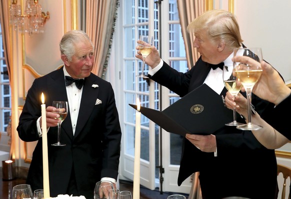 FILE - U.S. President Donald Trump and Britain&#039;s Prince Charles toast, during the Return Dinner in Winfield House, the residence of the Ambassador of the United States of America to the UK, in Re ...