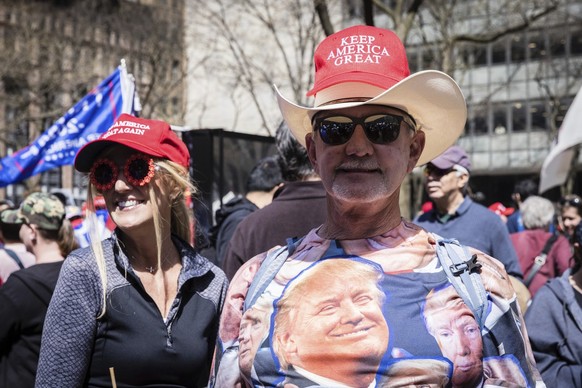 A supporter wearing a t-shirt with Former President Donald Trump&#039;s face on it attends a protest held in Collect Pond Park across the street from the Manhattan District Attorney&#039;s office in N ...