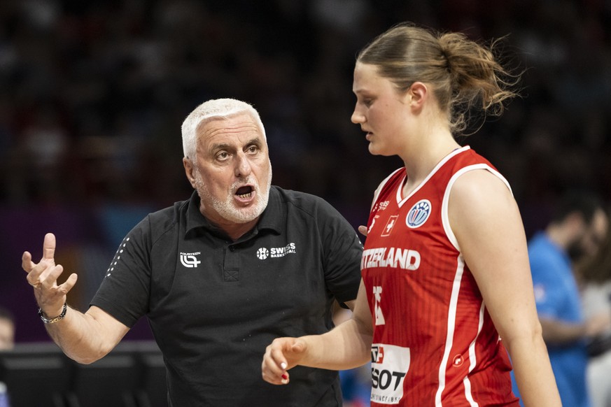 Swiss head coach Francois Gomez of France,left, talks to his player Lin Schwarz during the women&#039;s basketball match between Greece and Switzerland at the FIBA Women&#039;s Eurobasket European Cha ...