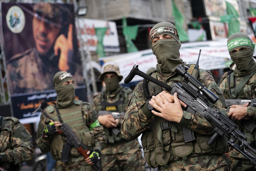 FILE - Hamas militants parade through the streets for Bassem Issa, a top Hamas&#039; commander, who was killed by Israeli Defense Forces military actions prior to a cease-fire in an 11-day war between ...
