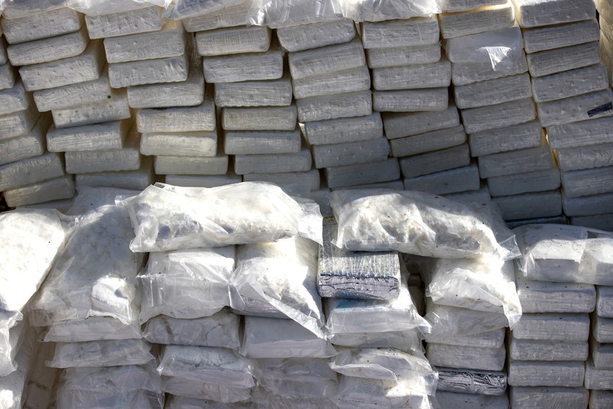 epa12553365 Confiscated cocaine piled up in Santo Domingo, Dominican Republic, 27 November 2025. The Dominican Republic incinerated 1,450 kilograms of cocaine that were seized during three separate co ...