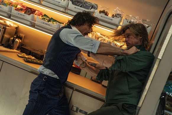 This image released by Sony Pictures shows Aaron Taylor-Johnson, left, and Brad Pitt in a scene from &quot;Bullet Train.&quot; (Scott Garfield/Sony Pictures via AP)