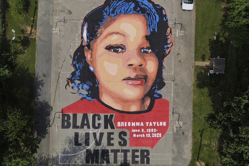 FILE - A ground mural depicting a portrait of Breonna Taylor is seen at Chambers Park in Annapolis, Md., July 6, 2020. The mural honors Taylor, a 26-year old Black woman who was fatally shot by police ...