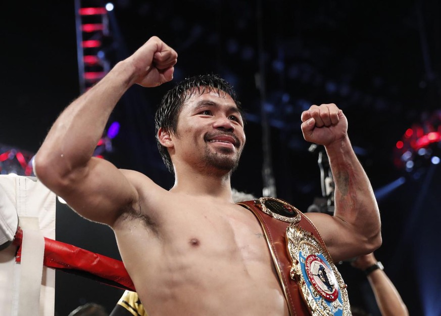 Manny Pacquiao, of the Philippines, celebrates after defeating Jessie Vargas in their WBO welterweight title boxing match, Saturday, Nov. 5, 2016, in Las Vegas. (AP Photo/Isaac Brekken)