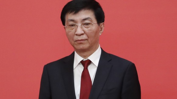 epa10260290 New member of the Standing Committee of the Political Bureau of the 20th Chinese Communist Party (CPC) Central Committee Wang Huning looks on during a press conference at the Great Hall of ...