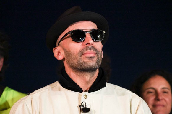epa12979739 French photographer and street artist JR speaks to members of the media as work continues on his installation of the artwork 'La Caverne du Pont Neuf' in Paris, France, 20 May 20 ...