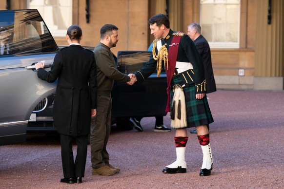 LONDON, ENGLAND - FEBRUARY 08: Ukrainian President Volodymyr Zelensky is greeted by Lieutenant Colonel Johnny Thompson, equerry to King Charles III, as he arrives for an audience with the King at Buck ...
