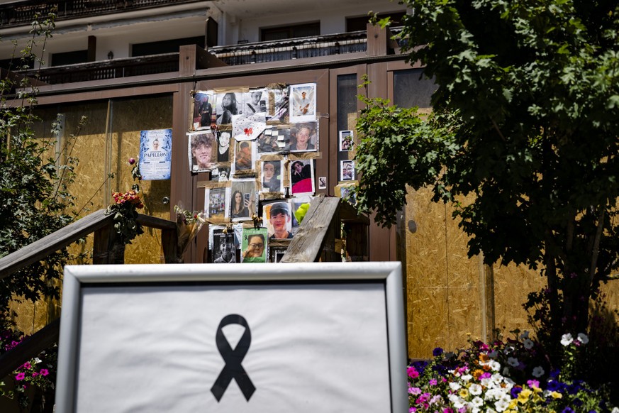 Portraits of the young victims are displayed at the entrance of the bar "Le Constellation" six moths later the deadly fire, in Crans-Montana, Switzerland, Thursday, July 9, 2026. Forty-one p ...