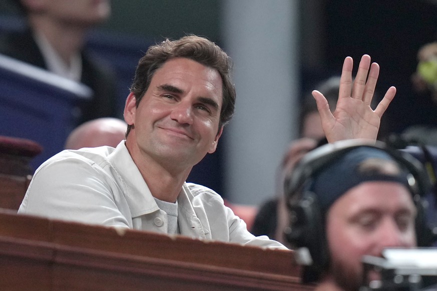 Former tennis player Roger Federer waves to the crowd as he watches Arthur Rinderknech of France play against Valentin Vacherot of Monaco during the final of the Shanghai Masters tennis tournament at  ...