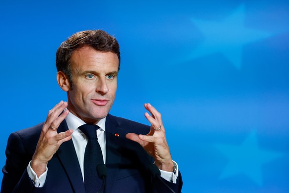 epa10257011 French President Emmanuel Macron speaks at a press conference at the end of the second day of an EU Summit in Brussels, Belgium, 21 October 2022. EU leaders reached an agreement on Energy  ...