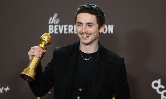 Beverly Hills, CA January 11, 2026 Timothee Chalamet holds his Award for Best Performance by a Male Actor in a Mation Picture - Muscial or Comedy for "Marty Supreme," at the 2026 Golden Glob ...