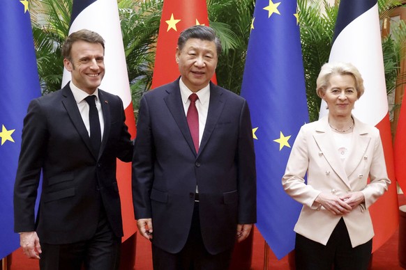 China&#039;s President Xi Jinping, center, his French counterpart Emmanuel Macron, left, and European Commission President Ursula von der Leyen meet for a working session in Beijing Thursday, April 6, ...