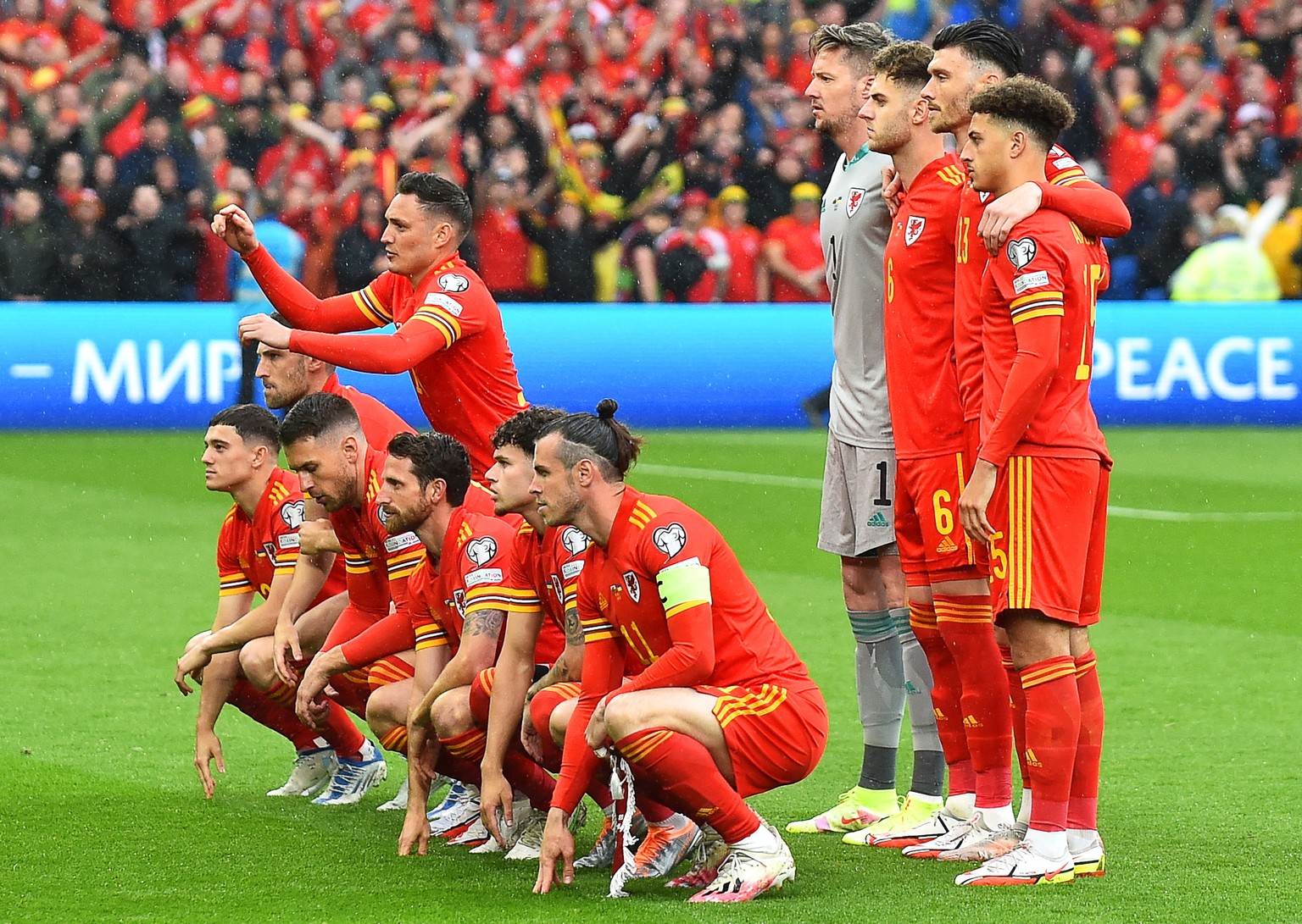epa10254029 Players of Wales line up for the FIFA World Cup 2022 qualification playoff soccer match between Wales and Ukraine in Cardiff, Britain, 05 June 2022. Left row from L: Daniel James, Ben Davi ...