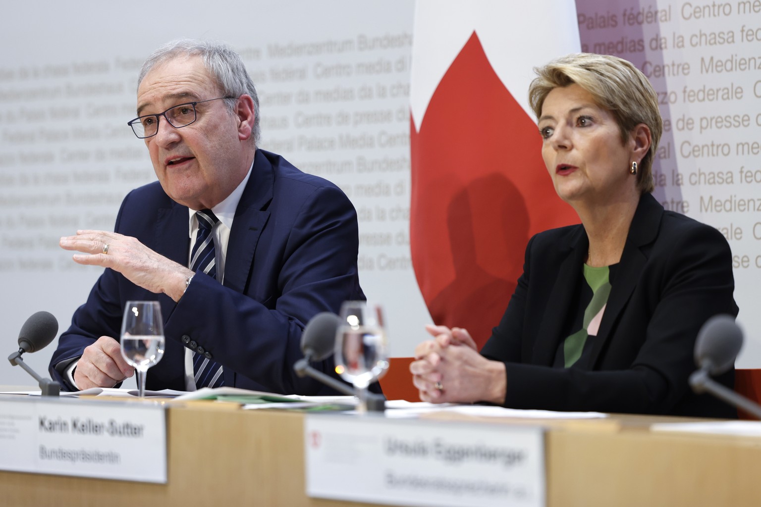 Swiss Federal Councillor Guy Parmelin, left, speaks next to Swiss Federal President Karin Keller-Sutter during a press conference on the new import tariffs into the US, Thursday, April 3, 2025, in Ber ...