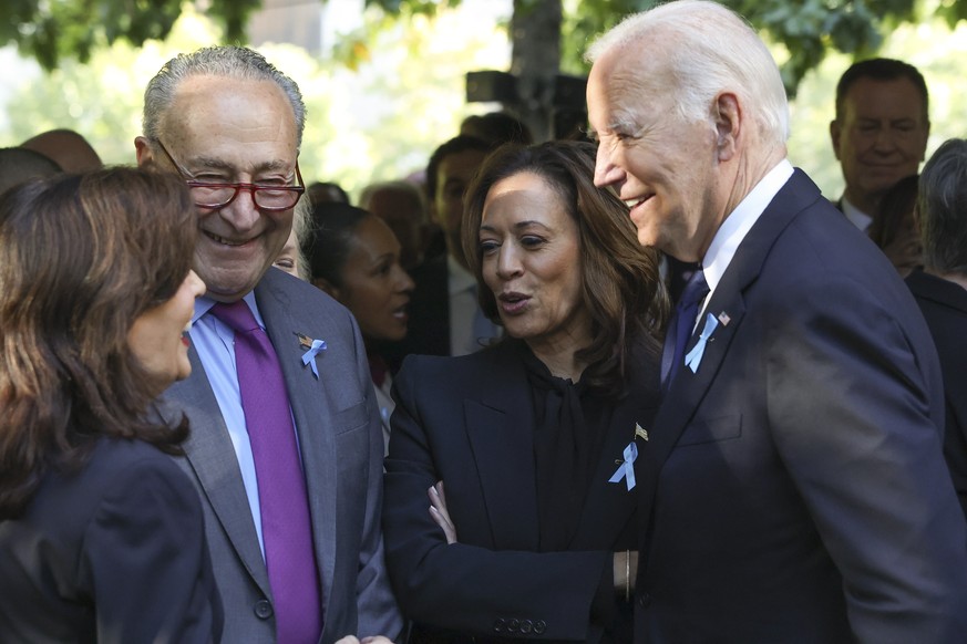 From left, New York Gov. Kathy Hochul, Sen. Chuck Schumer, D-NY, Democratic presidential nominee Vice President Kamala Harris and President Joe Biden talk while attending the 9/11 Memorial ceremony on ...