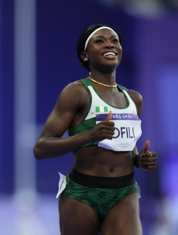 Julien Alfred, left, of Saint Lucia, and Favour Ofili, of Nigeria, compete in the women&#039;s 200-meters semifinal at the 2024 Summer Olympics, Monday, Aug. 5, 2024, in Saint-Denis, France. (AP Photo ...