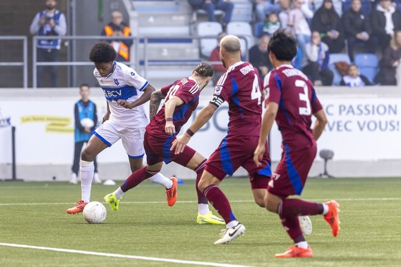 Alvyn Sanches (LS), left, fights for the ball with Yoan Severin (SFC), 2nd left, past Steve Rouiller (SFC), 2nd right, and Keigo Tsunemoto (SFC), right, during the Super League soccer match of Swiss C ...