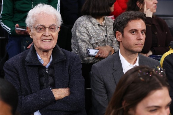 (FILES) Former French Prime Ministers Lionel Jospin (L) and Gabriel Attal attend the NBA basketball game between the Indiana Pacers and the San Antonio Spurs at the Accor Arena - Palais Omnisports de  ...