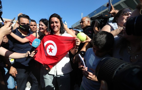 epa10069411 Tunisian tennis player Ons Jabeur is welcomed by supporters as she arrives in Tunis ,Tunisia, 13 July 2022. Jabeur lost her final match against Elena Rybakina of Kazakhstan at the Wimbledo ...