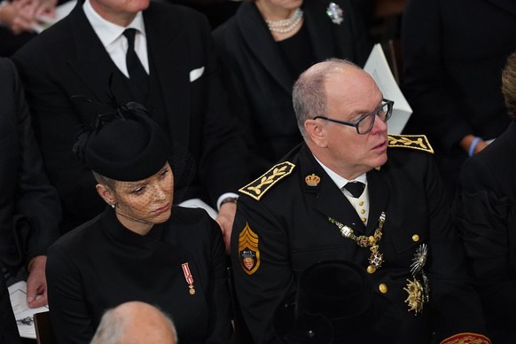 Prince Albert II and Princess Charlene of Monaco attending the State Funeral of Queen Elizabeth II, held at Westminster Abbey, London, Monday, Sept. 19, 2022. (/Pool photo via AP)