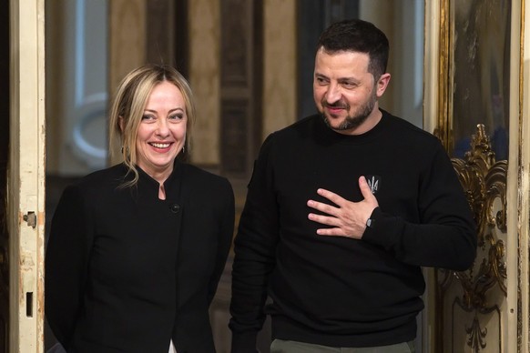 epa10625110 Italian Prime Minister Giorgia Meloni (L) and Ukraine&#039;s President Volodymyr Zelensky (R) arrive for a joint press conference at Chigi Palace in Rome, Italy, 13 May 2023. It is the fir ...