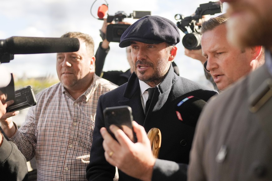 David Beckham speaks to media after he leaves Westminster Palace paying respect to the late Queen Elizabeth II during the Lying-in State, in Westminster Hall, London, England, Friday, Sept. 16, 2022.  ...