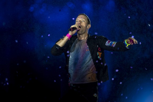 Lead singer Chris Martin of the British rock band Coldplay performs during the Rock in Rio music festival in Rio de Janeiro, Brazil, Sunday, Sept. 11, 2022. (AP Photo/Bruna Prado)