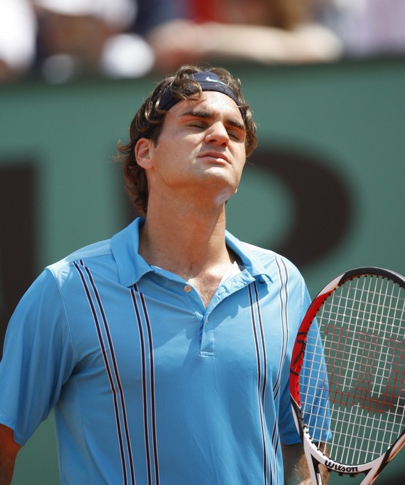 Switzerland's Roger Federer reacts as he plays Spain's Rafael Nadal, during their final match of the French Open tennis tournament, at the Roland Garros stadium, in Paris, Sunday, June 10, 2 ...