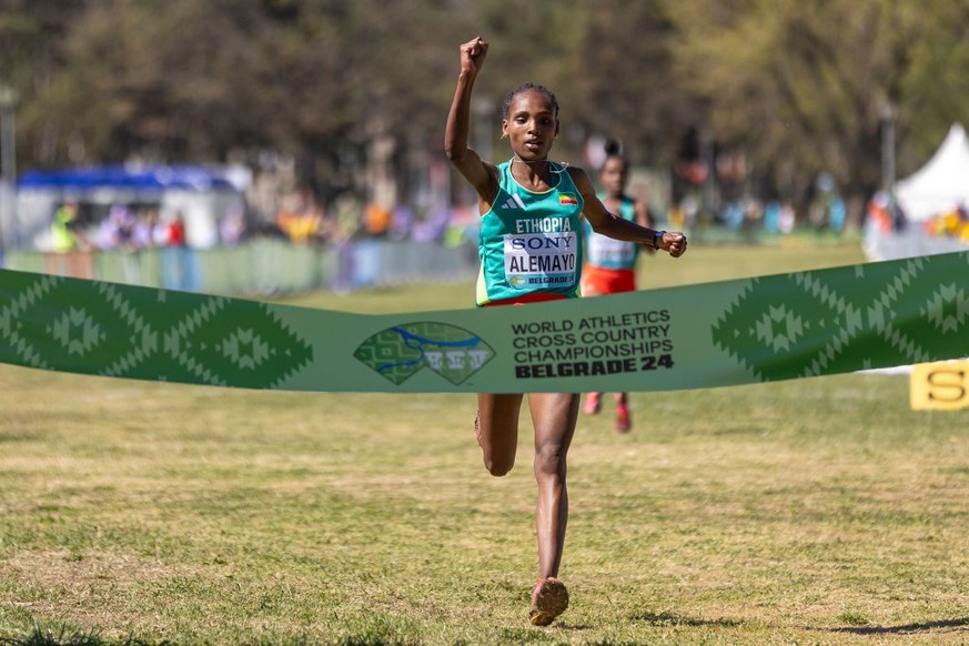BELGRADE, SERBIA - MARCH 30: Marta Alemayo of Ethiopia crosses the finish line to win the Women&#039;s U20 Final in the World Athletics Cross Country finals Championships at The Park of Friendship on  ...