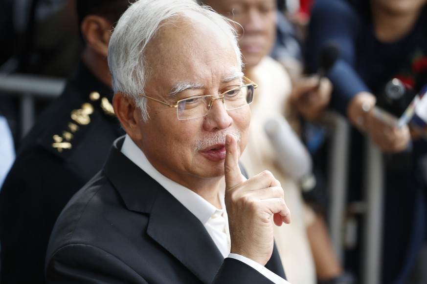 FILE - Former Malaysian Prime Minister Najib Razak gestures as he leaves the Malaysian Anti-Corruption Commission (MACC) Office in Putrajaya, Malaysia. May 24, 2018. Najib Razak on Tuesday, Aug. 23, 2 ...
