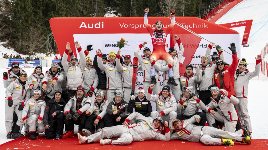 KEYPIX - Marco Odermatt of Switzerland and his staff react in the finish area during the men's Downhill race at the Alpine Skiing FIS Ski World Cup, in Wengen, Switzerland, Saturday, January 17,  ...