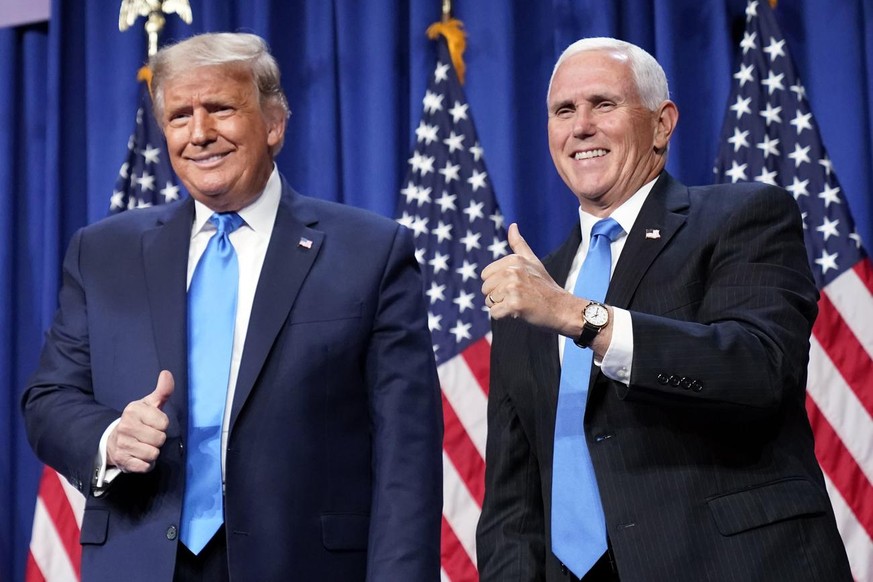 President Donald Trump and Vice President Mike Pence stand on stage during the first day of the 2020 Republican National Convention in Charlotte, N.C., Monday, Aug. 24, 2020. (AP Photo/Andrew Harnik)