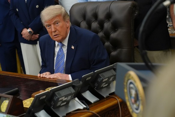 President Donald Trump attends an event about loosening a federal refrigerant rule, in the Oval Office at the White House, Thursday, May 21, 2026, in Washington. (AP Photo/Jacquelyn Martin)
Donald Tru ...