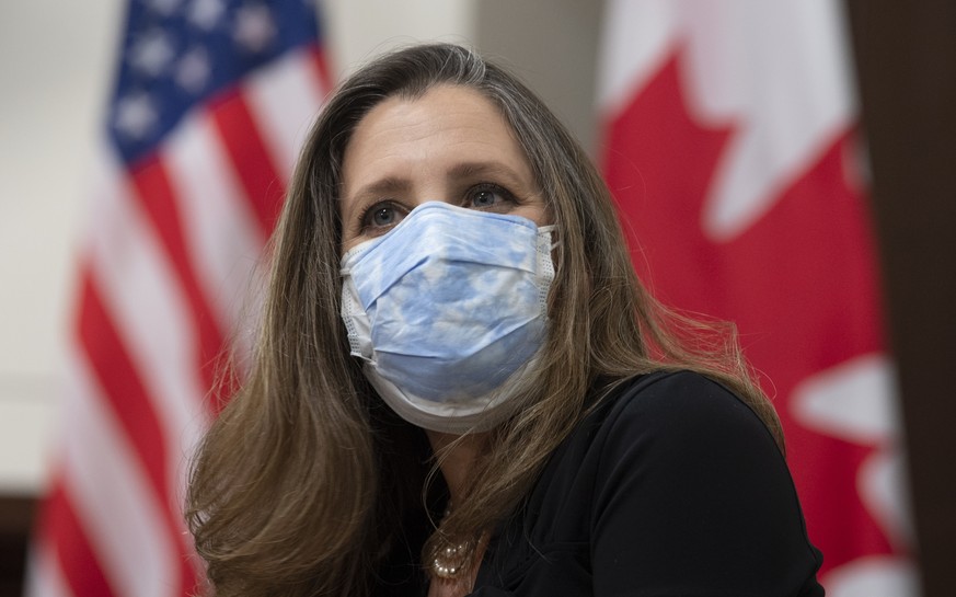 Deputy Prime Minister and Minister of Finance Chrystia Freeland looks on as she participates in a meeting with Canadian Prime Minister Justin Trudeau and virtually with United States President Joe Bid ...