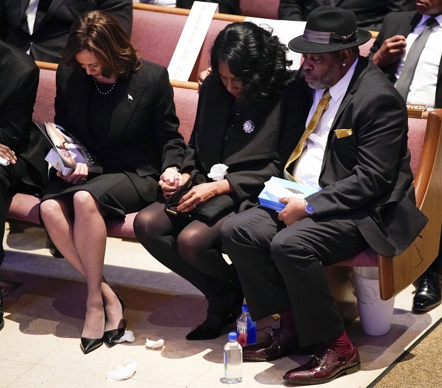 Vice President Kamala Harris, left, holds the hand of RowVaughn Wells as she is held by her husband Rodney Wells during the funeral service for her son Tyre Nichols at Mississippi Boulevard Christian  ...