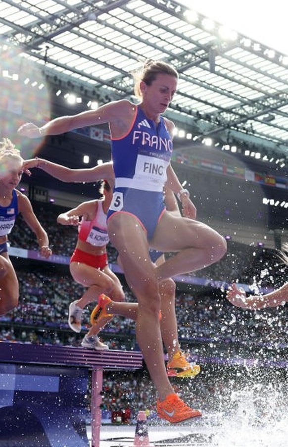 PARIS, FRANCE - AUGUST 04: Alice Finot of Team France clears the barrier during the Women&#039;s 3000m Steeplechase Round 1 on day nine of the Olympic Games Paris 2024 at Stade de France on August 04, ...