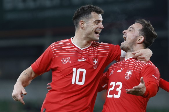 epa11245985 Switzerland&#039;s Xherdan Shaqiri, right, celebrates with teammate Granit Xhaka after scoring to 0:1 during the international friendly soccer match between Ireland and Switzerland at the  ...