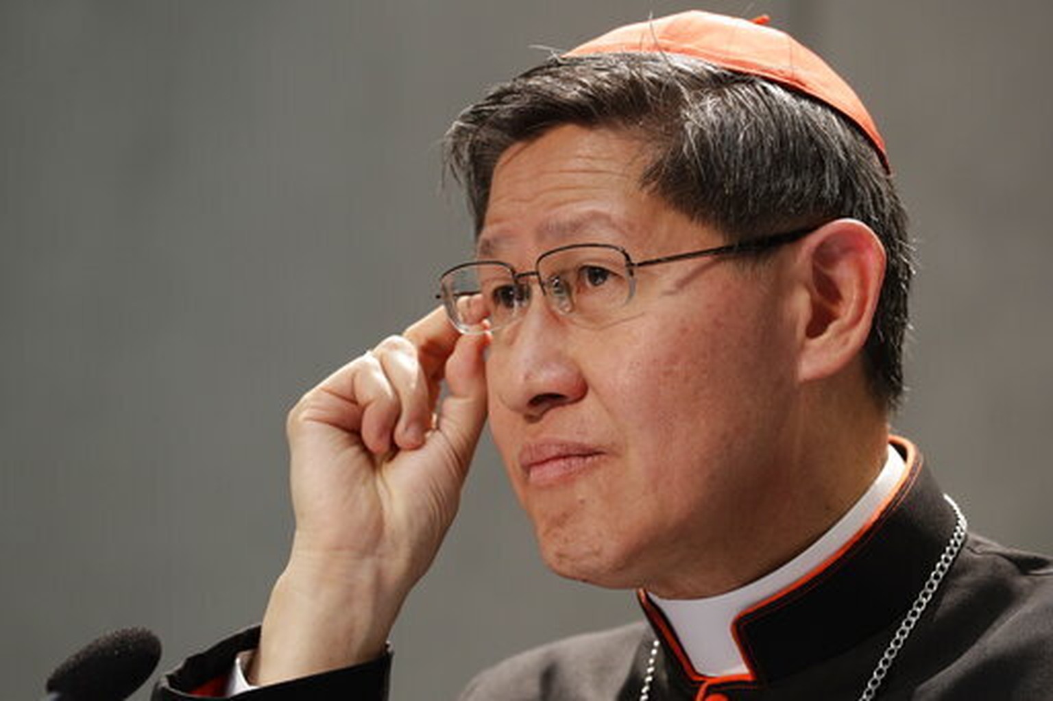 FILE - President of Caritas Internationalis Cardinal Luis Antonio Gokim Tagle makes a point during a press conference announcing the launch of a campaign on the plight of migrants to counteract mounti ...