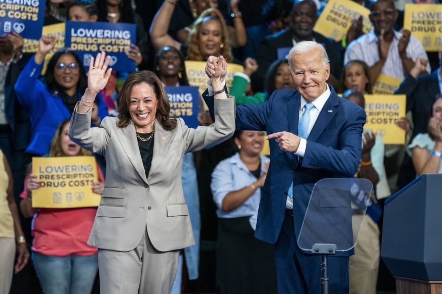 epaselect epa11550478 US President Joe Biden (R) and presumptive Democratic Presidential nominee, Vice President Kamala Harris, depart the stage following their remarks on the progress they are making ...