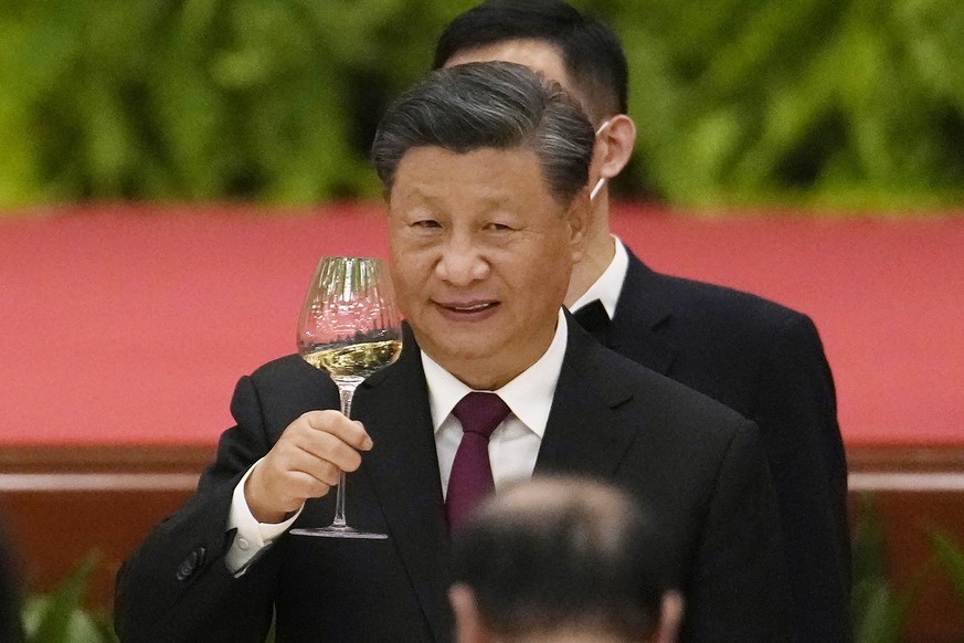 Chinese President Xi Jinping toasts during a dinner reception at the Great Hall of the People on the eve of the National Day holiday in Beijing, Friday, Sept. 30, 2022. (AP Photo/Ng Han Guan)